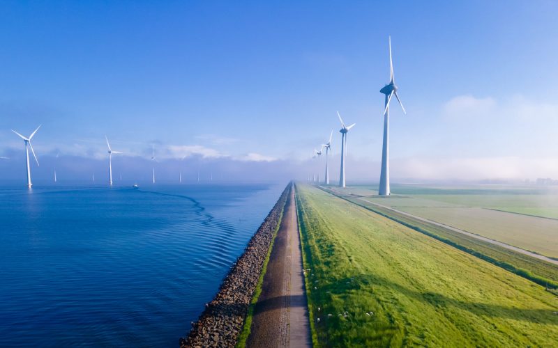 Offshore,Windmill,Park,With,Clouds,And,A,Blue,Sky,,Windmill